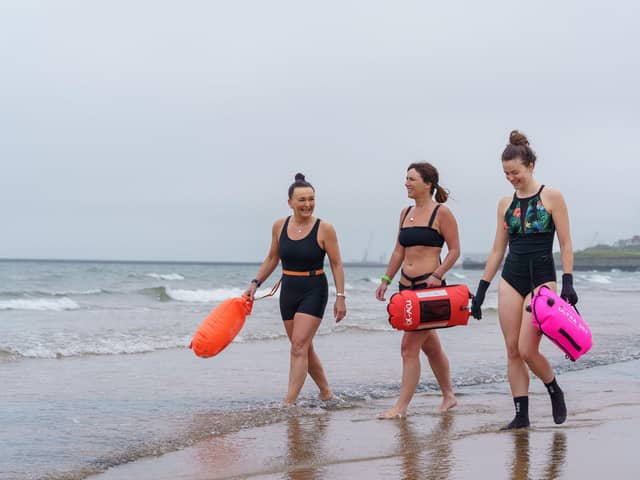 Sam Petrie, Hayley Dorian and Naomi Brehm from the Wild Sea Women swimming group get ready for a dip in the sea at Seaburn beach in Sunderland -- the women have been taking part in a unique study which sought to identify biological changes in the body caused by exposure to cold water. Picture: David Wood