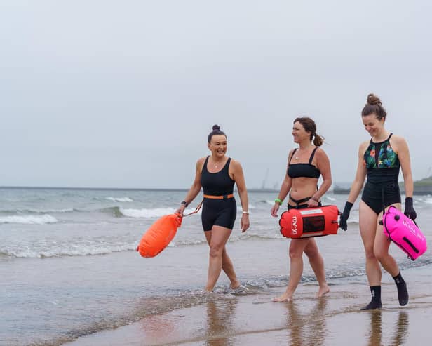 Sam Petrie, Hayley Dorian and Naomi Brehm from the Wild Sea Women swimming group get ready for a dip in the sea at Seaburn beach in Sunderland -- the women have been taking part in a unique study which sought to identify biological changes in the body caused by exposure to cold water. Picture: David Wood