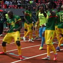 Mali's forward Ibrahima Kone (L) celebrates with teammates after scoring what proved to be the winner in a controversial AFCON match against Tunisia  (Photo by ISSOUF SANOGO/AFP via Getty Images)