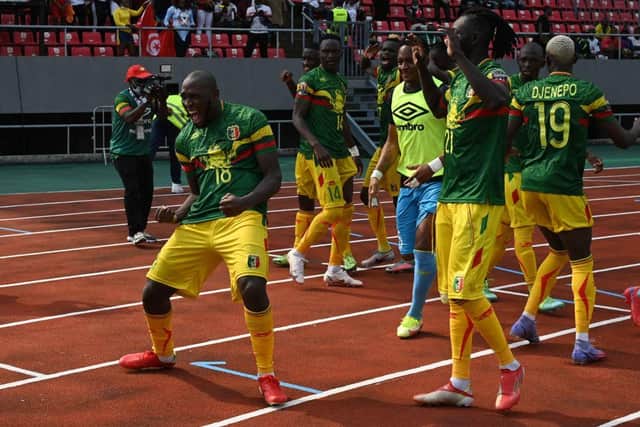 Mali's forward Ibrahima Kone (L) celebrates with teammates after scoring what proved to be the winner in a controversial AFCON match against Tunisia (Photo by ISSOUF SANOGO/AFP via Getty Images)