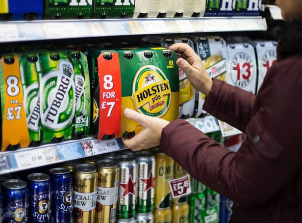 A consumer purchases beer from a supermarket in Scotland. Picture: John Devlin