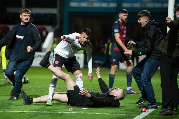 Bojan Miovski and these Aberdeen fans were left disappointed by an offside flag but the Dons held firm for victory.
