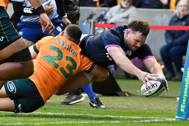 Ewan Ashman scores for Scotland against Australia.