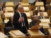 Deputy Scottish First Minister John Swinney delivers the Scottish Budget for 2023-24 to the Scottish Parliament earlier this month (Picture: Andrew Cowan/pool/Getty Images)
