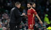 Aberdeen's Graeme Shinnie shakes hands with his manager Barry Robson after a chastening defeat at Celtic Park.