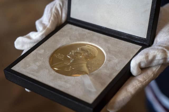 The Nobel Prize winners receive this medal as part of the prestigious award. Photo: AP Photo/Jacquelyn Martin.