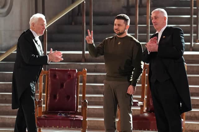 Ukrainian President Volodymyr Zelensky gives a V-for-Victory sign following his address to MPs and Lords in Westminster Hall (Picture: Stefan Rousseau/PA)