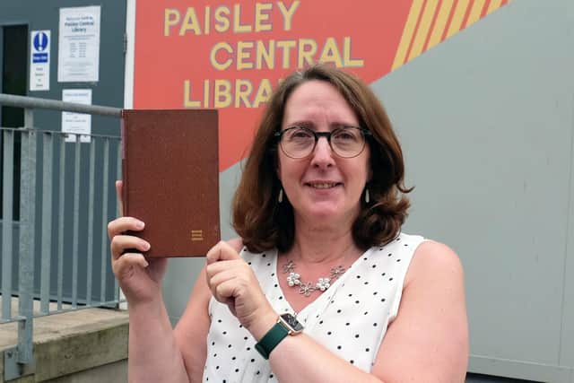Paisley Central Library Team Supervisor Linda Flynn with a recipe book which has been returned to the library over 50 years after it was due to be returned. (Picture credit:  Macdonald Media/PA Wire)