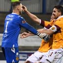 Motherwell goalkeeper Trevor Carson (L) celebrates winning the penalty shootout with Declan Gallagher and Stephen O'Donnell after the Europa League qualifier in Coleraine. (Photo by Ross MacDonald / SNS Group)