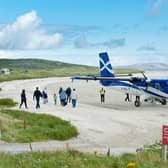 Barra's beach runway hosts some 13,000 passengers a year