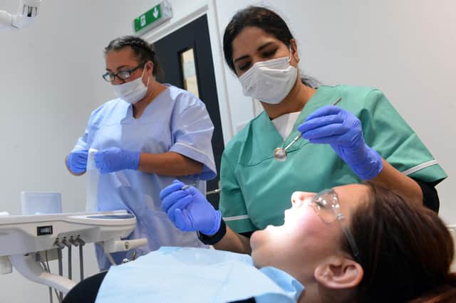 Dentist Kusum Chawla with dental nurse Jayde Williamson. Picture: Stu Norton