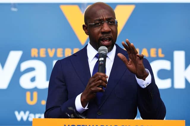 Earlier today, Rev. Warnock, 51, beat Senator Kelly Loeffler, with 50.7 per cent of the vote, becoming the first Black Democrat elected to the Senate from any southern state.  (Photo by Michael M. Santiago/Getty Images)