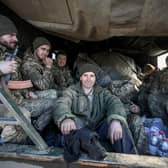 Ukrainian service personnel sit in the back of military truck in the town of Avdiivka, on the front-line with Russia-backed separatists (Picture: Aleksey Filippov/AFP via Getty Images)