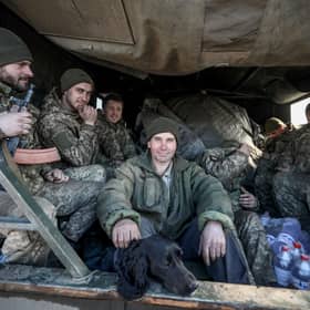 Ukrainian service personnel sit in the back of military truck in the town of Avdiivka, on the front-line with Russia-backed separatists (Picture: Aleksey Filippov/AFP via Getty Images)