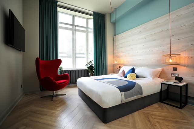 A king en suite room, one 40 guest rooms at Revolver in Glasgow. See Pic: Revolver/PA.