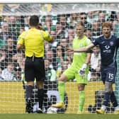 Ross County's Simon Murray remonstrates with referee Nick Walsh after having his appeal for a penalty waved away by the official. (Photo by Craig Foy / SNS Group)