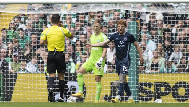 Ross County's Simon Murray remonstrates with referee Nick Walsh after having his appeal for a penalty waved away by the official. (Photo by Craig Foy / SNS Group)