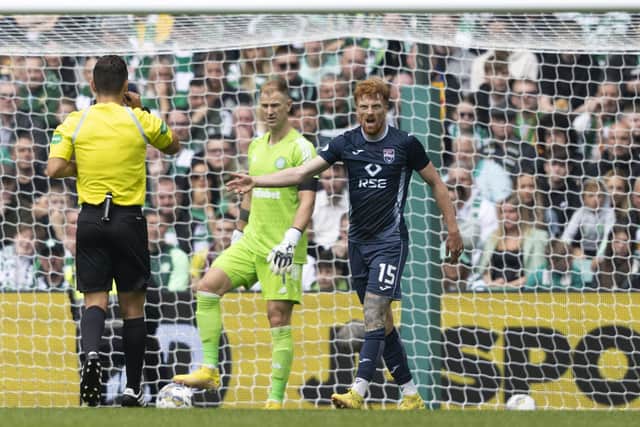Ross County's Simon Murray remonstrates with referee Nick Walsh after having his appeal for a penalty waved away by the official. (Photo by Craig Foy / SNS Group)