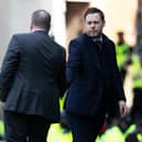 Celtic manager Ange Postecoglou shakes the hand of his Rangers counterpart Michael Beale at full time.