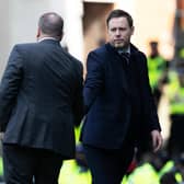 Celtic manager Ange Postecoglou shakes the hand of his Rangers counterpart Michael Beale at full time.