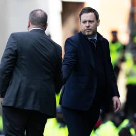 Celtic manager Ange Postecoglou shakes the hand of his Rangers counterpart Michael Beale at full time.