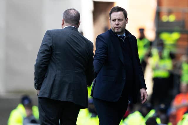 Celtic manager Ange Postecoglou shakes the hand of his Rangers counterpart Michael Beale at full time.