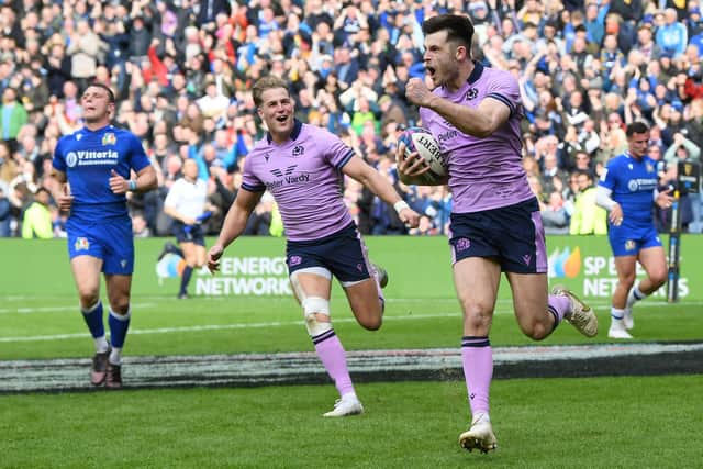 Blair Kinghorn celebrates his brilliant, late try against Italy, with creator Duhan van der Merwe cheering him on. (Photo by Ross Parker / SNS Group)