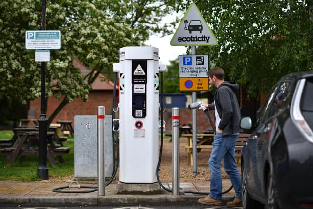 Public charging points can mean a lot of hanging around (Picture: Ben Stansall/AFP/Getty)
