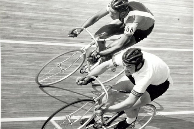 Two cyclists vie for the lead at the track cycling at the 1970 Edinburgh Commonwealth Games.
