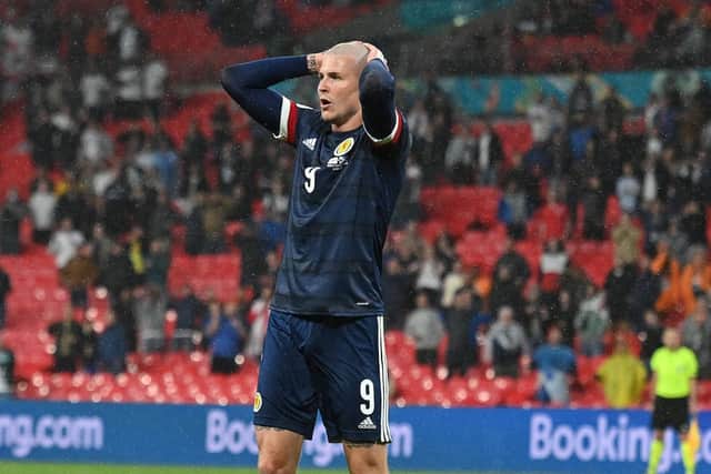Scotland's Lyndon Dykes reacts to a missed chance during the 0-0 draw with England at Wembley (Photo by JUSTIN TALLIS/POOL/AFP via Getty Images)