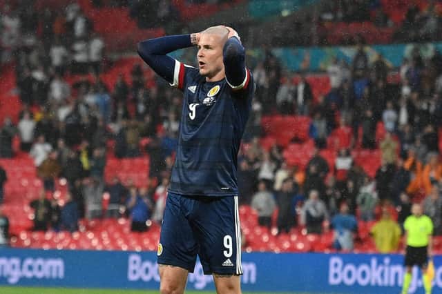Scotland's Lyndon Dykes reacts to a missed chance during the 0-0 draw with England at Wembley (Photo by JUSTIN TALLIS/POOL/AFP via Getty Images)