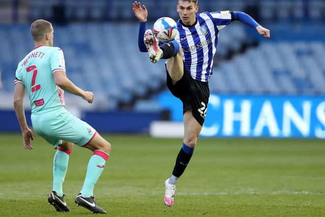 Liam Shaw of Sheffield Wednesday controls the ball Ryan Bennett of Swansea City looks on. (Photo by George Wood/Getty Images)