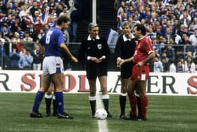 Referee George Smith with the Rangers and Aberdeen captains, Terry Butcher (left) and Willie Miller before kick-off in the 1988 League Cup final.
