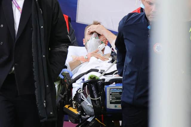 Christian Eriksen is stretchered off the pitch following his cardiac arrest in Copenhagen during Denmark v Finland.