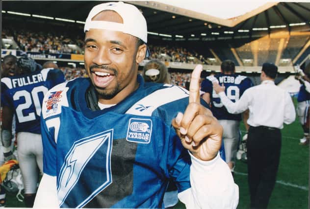 Khari Jones,  celebrates winning the World Bowl in 1996.