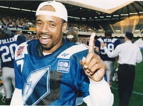 Khari Jones,  celebrates winning the World Bowl in 1996.