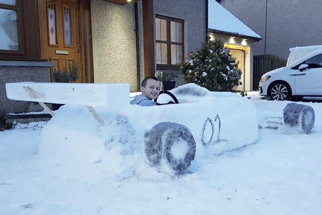 With the help of mum Claire, 34, and dad Dave, 37, they built the life-like F1 racing car in four and a half hours – complete with black wheels, a seat and spoiler.