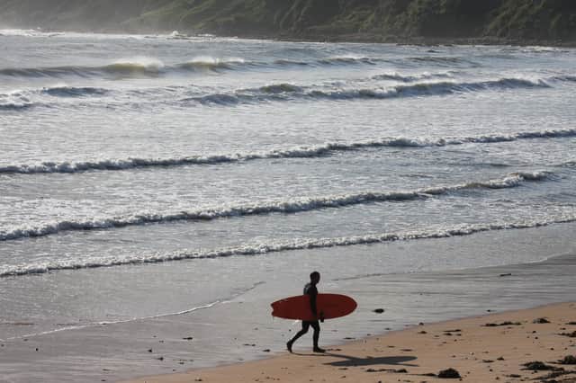 A surfer leaves the water at East Sands, St Andrews. PIC: Roger Cox / National World