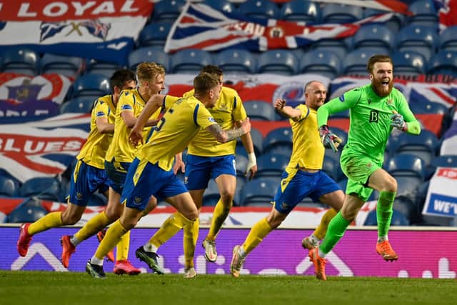 Zander Clark races away after playing a huge role in St Johnstone's last-gasp equaliser at Ibrox. Picture: SNS