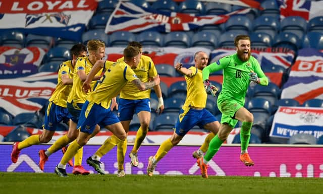 Zander Clark races away after playing a huge role in St Johnstone's last-gasp equaliser at Ibrox. Picture: SNS