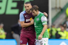 Aston Villa's John McGinn consoles his former Hibs team-mate Lewis Stevenson at full time. (Photo by Ross Parker / SNS Group)