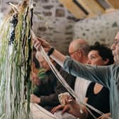 Participants get involved in Grain, the second of the three 'acts' of the interactive Gathering Table art project. Picture: Jassy Earl