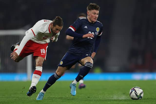 Nathan Patterson out-paces Grzegorz Krychowiak during the friendly at Hampden. (Photo by Ian MacNicol/Getty Images)