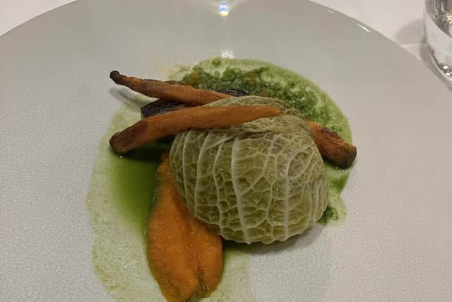Braised pearl barley stuffed cabbage with spiced carrot puree, pickled turnip, roasted heritage heritage carrots and shallot, parsley sauce, at the hotel's AA Rosette Awarded Road Hole Restaurant restaurant.
