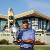 Winning Continental Europe captain Francesco Molinari shows off the trophy at Abu Dhabi Golf Club. Picture: Andrew Redington/Getty Images.