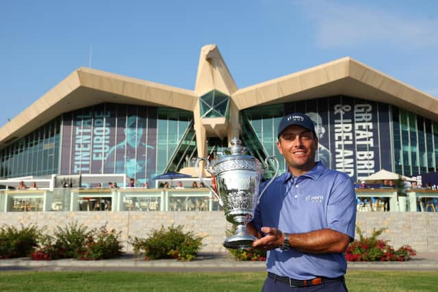 Winning Continental Europe captain Francesco Molinari shows off the trophy at Abu Dhabi Golf Club. Picture: Andrew Redington/Getty Images.