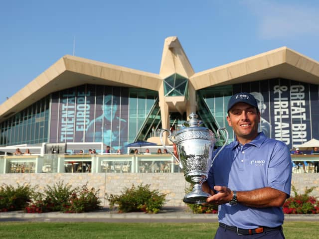 Winning Continental Europe captain Francesco Molinari shows off the trophy at Abu Dhabi Golf Club. Picture: Andrew Redington/Getty Images.