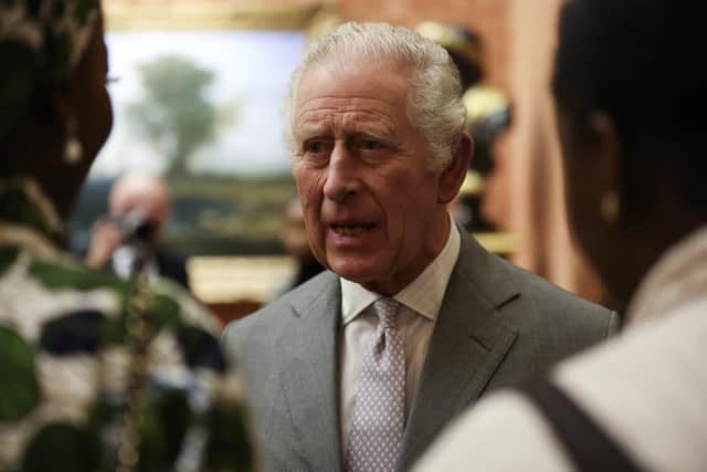 Britain's King Charles III speaks to guests during a reception to celebrate small and medium-sized businesses at Buckingham Palace in London, Wednesday Nov. 16, 2022. (Isabel Infantes/Pool via AP)