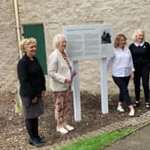 The plaque remembering the Corstorphine witches has been erected outside Dower House in Edinburgh.