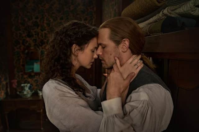 Sam Heughan and Caitriona Balfe as Jamie and Claire in Outlander (Starz)